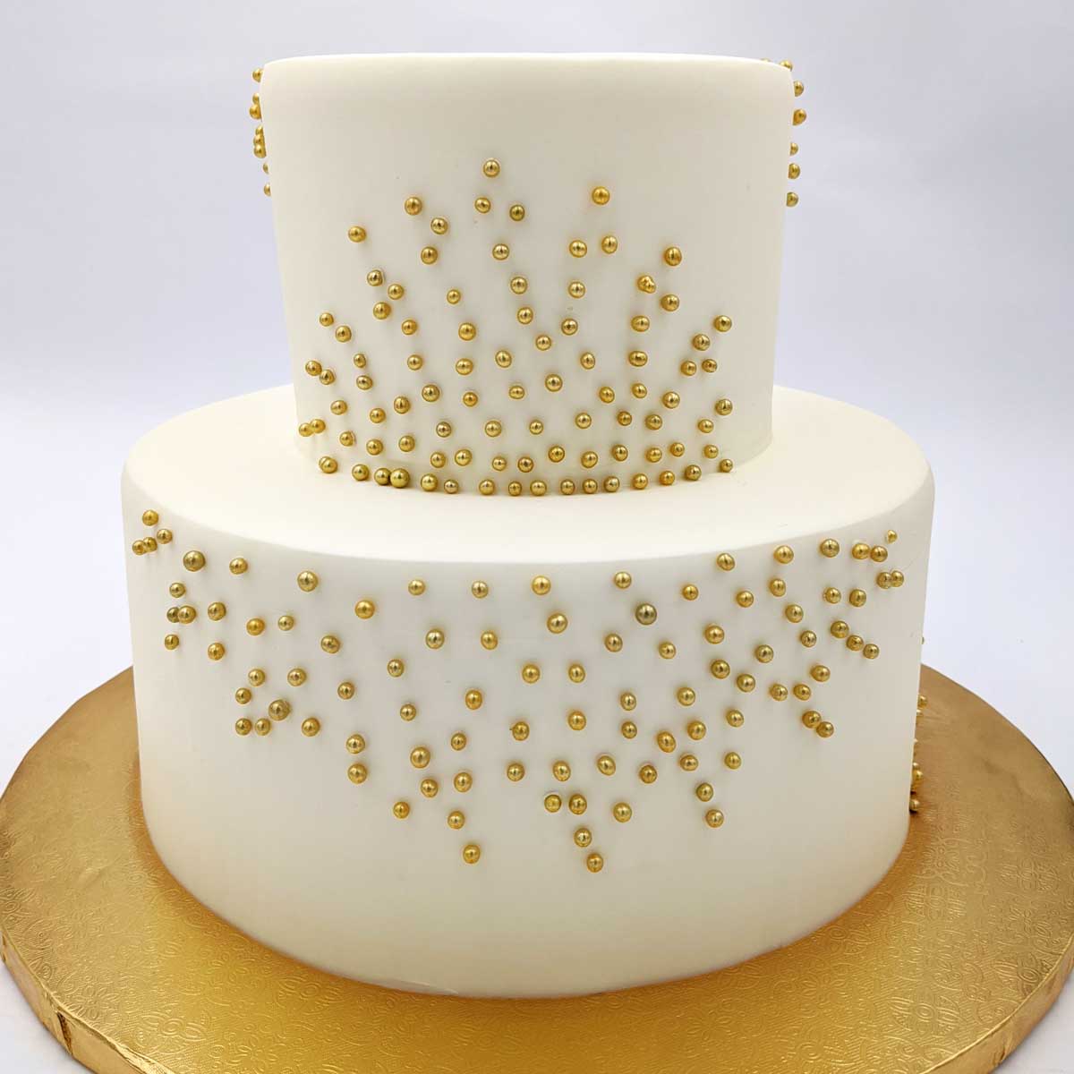 Gold sugar pearls cake  Wedding anniversary cakes, Beautiful wedding cakes,  Simple cake designs