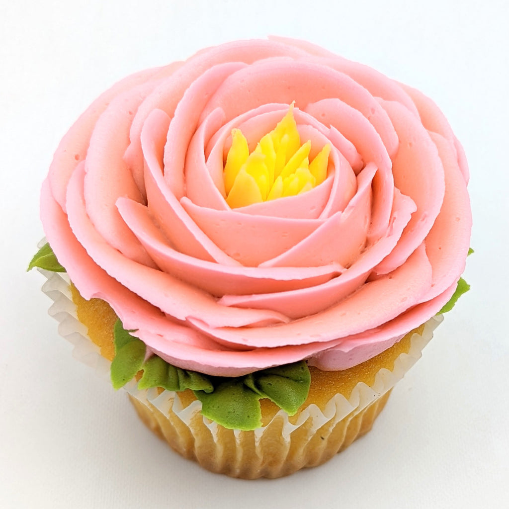 https://deerfieldsbakery.com/cdn/shop/products/Pink-Fancy-Flower-Large-Cupcake_1024x1024.jpg?v=1656529569